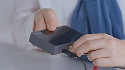 Connecting a TV adapter to enable hearing aids to stream audio from the television