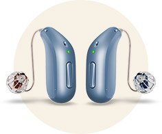 Two sleek, blue Oticon hearing aids with slim wires connected to transparent in-ear receivers, positioned against a neutral circular background, showcasing advanced hearing technology for discreet and comfortable use.