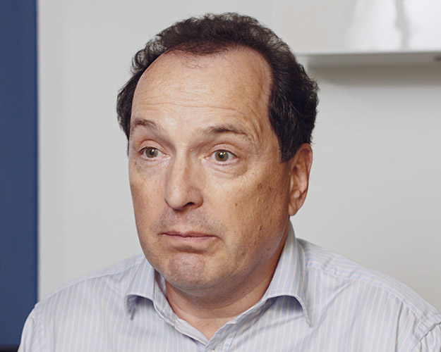 Image shows smiling man