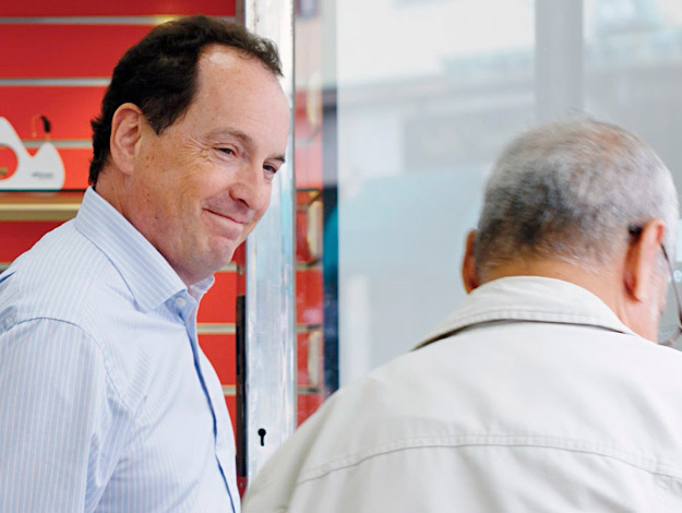 Image shows audiologist smiling in the hearing clinic