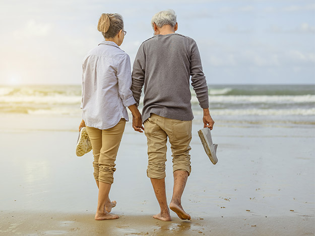 couple walking by the beach
