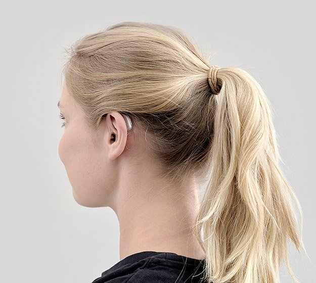 Bild zeigt lächelnde Hörakustiker.