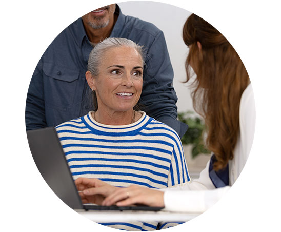 A lady getting a consultation on ear wax removal procedure