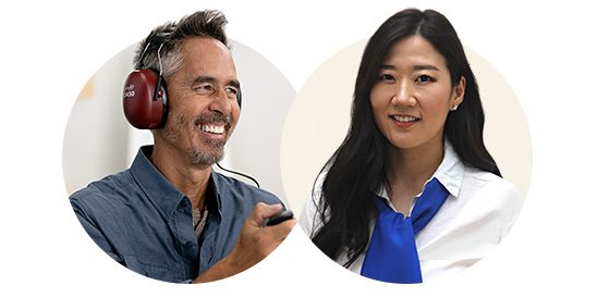 [GEN] A man wearing red over-ear headphones holds a response button during a hearing test, while a woman in a white blouse and blue scarf stands nearby, possibly an audiologist.