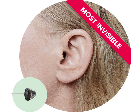 Invisible-in-the-canal hearing aid placed discreetly in the ear, highlighted with a ’Most Invisible’ label.