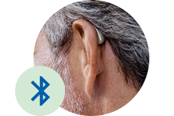Oor met hoorapparaat en Bluetooth-pictogram
